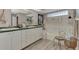 Bright bathroom with a soaking tub, double sink vanity, and charming decorative details at 3514 Laslo Ave, North Port, FL 34287