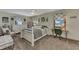 Bright bedroom with a comfy bed, natural light, and stylish decor at 3514 Laslo Ave, North Port, FL 34287