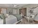 Cozy bedroom with barn door accent, a ceiling fan and plenty of charm at 3514 Laslo Ave, North Port, FL 34287