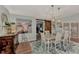 Elegant dining area with rustic wood accents, stylish lighting, and unique decor at 3514 Laslo Ave, North Port, FL 34287