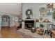 Living room fireplace with brick hearth and mantel, decorative accents, and inviting ambiance at 3514 Laslo Ave, North Port, FL 34287