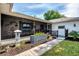 Comfortable front porch with unique decorations and a cozy seating arrangement at 3514 Laslo Ave, North Port, FL 34287