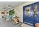 Charming front porch entrance with comfortable seating and tasteful decorations at 3514 Laslo Ave, North Port, FL 34287