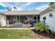 Cozy front porch area featuring a seating area and tastefully decorated flower boxes at 3514 Laslo Ave, North Port, FL 34287
