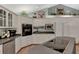 Well-lit kitchen showcasing white cabinetry, dark countertops, and sleek stainless-steel appliances at 3514 Laslo Ave, North Port, FL 34287