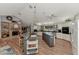 Open kitchen and breakfast nook featuring a brick fireplace and a large island with seating at 3514 Laslo Ave, North Port, FL 34287