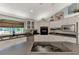 Bright eat-in kitchen featuring white cabinets, dark countertops, and a modern island cooktop at 3514 Laslo Ave, North Port, FL 34287