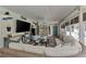 Inviting living room with cozy seating, TV, and access to a covered outdoor space at 3514 Laslo Ave, North Port, FL 34287