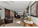 Inviting living room with sliding barn doors, comfortable seating, and stylish decor at 3514 Laslo Ave, North Port, FL 34287