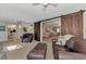 Relaxing living room with sliding barn doors leading to the kitchen and comfortable seating at 3514 Laslo Ave, North Port, FL 34287