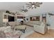 Comfortable living room with vaulted ceilings, ceiling fans, and plush seating arrangement at 3514 Laslo Ave, North Port, FL 34287