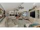Expansive living room featuring a fireplace, entertainment center, and comfortable seating at 3514 Laslo Ave, North Port, FL 34287