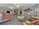 An expansive main bedroom featuring plush carpeting, a seating area, and elegant decor at 3514 Laslo Ave, North Port, FL 34287