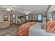 Spacious main bedroom with seating area, soft carpet, and peaceful decor at 3514 Laslo Ave, North Port, FL 34287