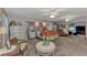 Spacious main bedroom featuring plush carpet, stylish furnishings, and ample natural light at 3514 Laslo Ave, North Port, FL 34287