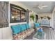 Inviting porch seating area with stylish cushions and decor with ample space for relaxation at 3514 Laslo Ave, North Port, FL 34287