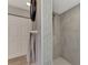 Modern tiled shower stall featuring neutral tile work and contemporary fixtures at 3514 Laslo Ave, North Port, FL 34287