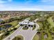 An aerial view of the gated community, featuring lush landscaping, water features and beautiful homes at 3564 Santa Caterina Blvd, Lakewood Ranch, FL 34211