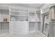 A large, bright walk-in closet with custom built-in shelving and ample storage space at 3564 Santa Caterina Blvd, Lakewood Ranch, FL 34211