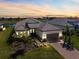 Stunning single-Gathering home boasts mature landscaping, brick paved driveway, and three-car garage at 3564 Santa Caterina Blvd, Lakewood Ranch, FL 34211