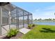 A screened-in lanai overlooks the pool and beautiful lake, seamlessly connecting indoor and outdoor living spaces at 3564 Santa Caterina Blvd, Lakewood Ranch, FL 34211