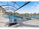 Inviting swimming pool boasts a sun shelf and captivating views of the tranquil lake and community landscape at 3564 Santa Caterina Blvd, Lakewood Ranch, FL 34211