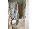 Bathroom with shower curtain and tiled walls at 3784 59Th W Ave # 3784, Bradenton, FL 34210