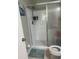 Bathroom featuring a glass-enclosed shower, toilet, and tiled floor with shower head at 3784 59Th W Ave # 3784, Bradenton, FL 34210