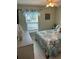 Bright bedroom with a white metal frame bed, nautical themed comforter and shams at 3784 59Th W Ave # 3784, Bradenton, FL 34210