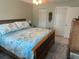 Bedroom features a comfortable bed, neutral wall paint and carpet, and closet storage at 3784 59Th W Ave # 3784, Bradenton, FL 34210