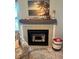 The fireplace has a light gray mantel adorned with decorative items and a decorative painting on top at 3784 59Th W Ave # 3784, Bradenton, FL 34210