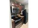 Kitchen featuring stainless steel appliances, brown cabinets, and a tile backsplash at 3784 59Th W Ave # 3784, Bradenton, FL 34210