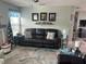 Living room area showcasing a large couch, decorative throw pillows and decor throughout at 3784 59Th W Ave # 3784, Bradenton, FL 34210