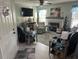 Cozy living room showcasing a fireplace, comfortable seating, and a view of the front door at 3784 59Th W Ave # 3784, Bradenton, FL 34210