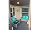 Inviting screened-in porch featuring comfortable seating and charming decor at 3784 59Th W Ave # 3784, Bradenton, FL 34210
