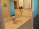 Bathroom with vanity, large mirror, and built-in soap dispensers at 3790 Pinebrook Cir # 103, Bradenton, FL 34209
