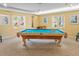 Well-lit billiards room with a classic pool table and comfortable seating, perfect for recreation at 3790 Pinebrook Cir # 103, Bradenton, FL 34209