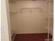 Walk-in closet with ample shelving and hardwood floors at 3790 Pinebrook Cir # 103, Bradenton, FL 34209