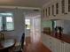 Bright dining area with built-in buffet and view to the kitchen and lanai at 3790 Pinebrook Cir # 103, Bradenton, FL 34209