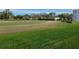 Golf course with lush green grass and community in background at 3790 Pinebrook Cir # 103, Bradenton, FL 34209