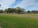 Beautiful golf course view with trees and a pond at 3790 Pinebrook Cir # 103, Bradenton, FL 34209