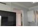 Bright kitchen with white crown molding, cabinetry and an open view to the bedroom at 3790 Pinebrook Cir # 103, Bradenton, FL 34209
