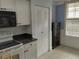 This kitchen has bright white cabinets, dark granite countertops, modern appliances and ample storage space at 3790 Pinebrook Cir # 103, Bradenton, FL 34209