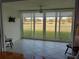 Tiled lanai boasting golf course views through large glass windows at 3790 Pinebrook Cir # 103, Bradenton, FL 34209