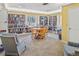 Charming library featuring extensive bookshelves, a cozy reading nook, and a welcoming atmosphere at 3790 Pinebrook Cir # 103, Bradenton, FL 34209