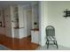 Cozy living room featuring custom built-in shelving and storage, with view to the dining area at 3790 Pinebrook Cir # 103, Bradenton, FL 34209