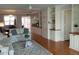 Spacious living area with built-in cabinets, open shelving, hardwood floors, and comfortable seating at 3790 Pinebrook Cir # 103, Bradenton, FL 34209