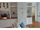 Comfortable living room featuring a custom built-in shelving and storage with glass shelving at 3790 Pinebrook Cir # 103, Bradenton, FL 34209
