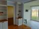 Spacious living room with built-in shelving and storage, seamlessly connected to sunroom at 3790 Pinebrook Cir # 103, Bradenton, FL 34209