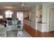 Spacious living area with built-in cabinets, open shelving, hardwood floors, comfortable seating, and decorative touches at 3790 Pinebrook Cir # 103, Bradenton, FL 34209